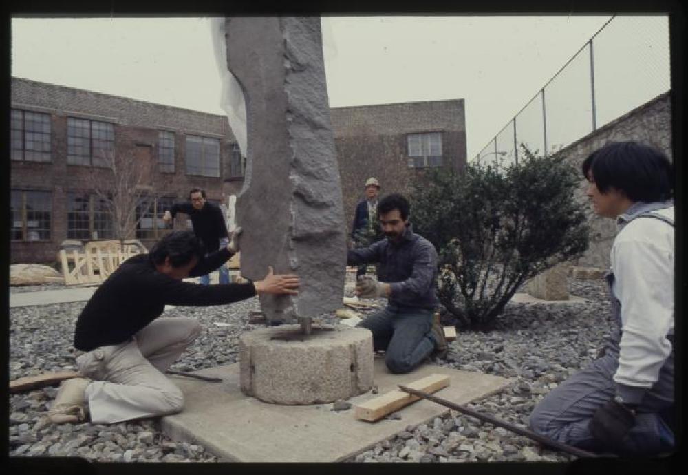 Unpacking and installation of To Tallness in the garden, 1982-83