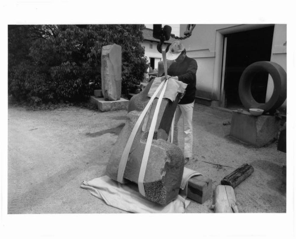 Masatoshi Izumi rigging a sculpture the yard of Isamu Noguchi's studio in Mure, Shikoku, Japan