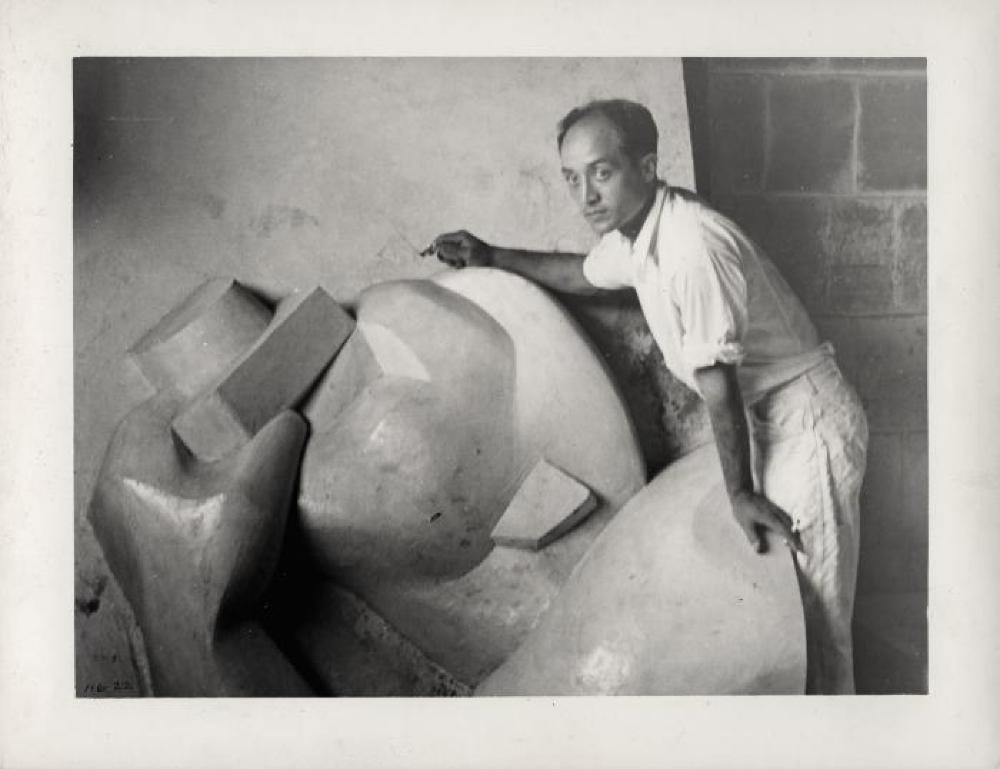 Isamu Noguchi working on Associated Press Building Plaque