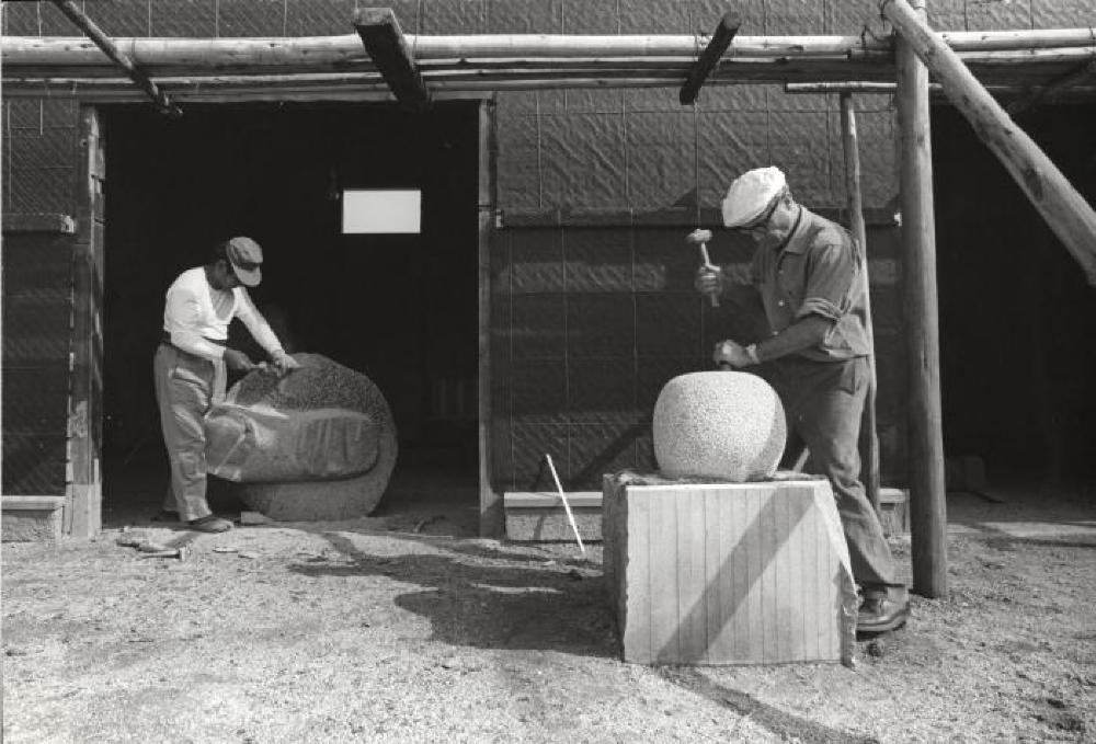 Isamu Noguchi and assistant at work on "Childhood" and "The Seeker Sought" at his studio in Mure (Shikoku, Japan)