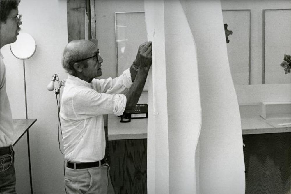 Isamu Noguchi working with Peter Carlson on prototype series of editioned sculptures for Gemini