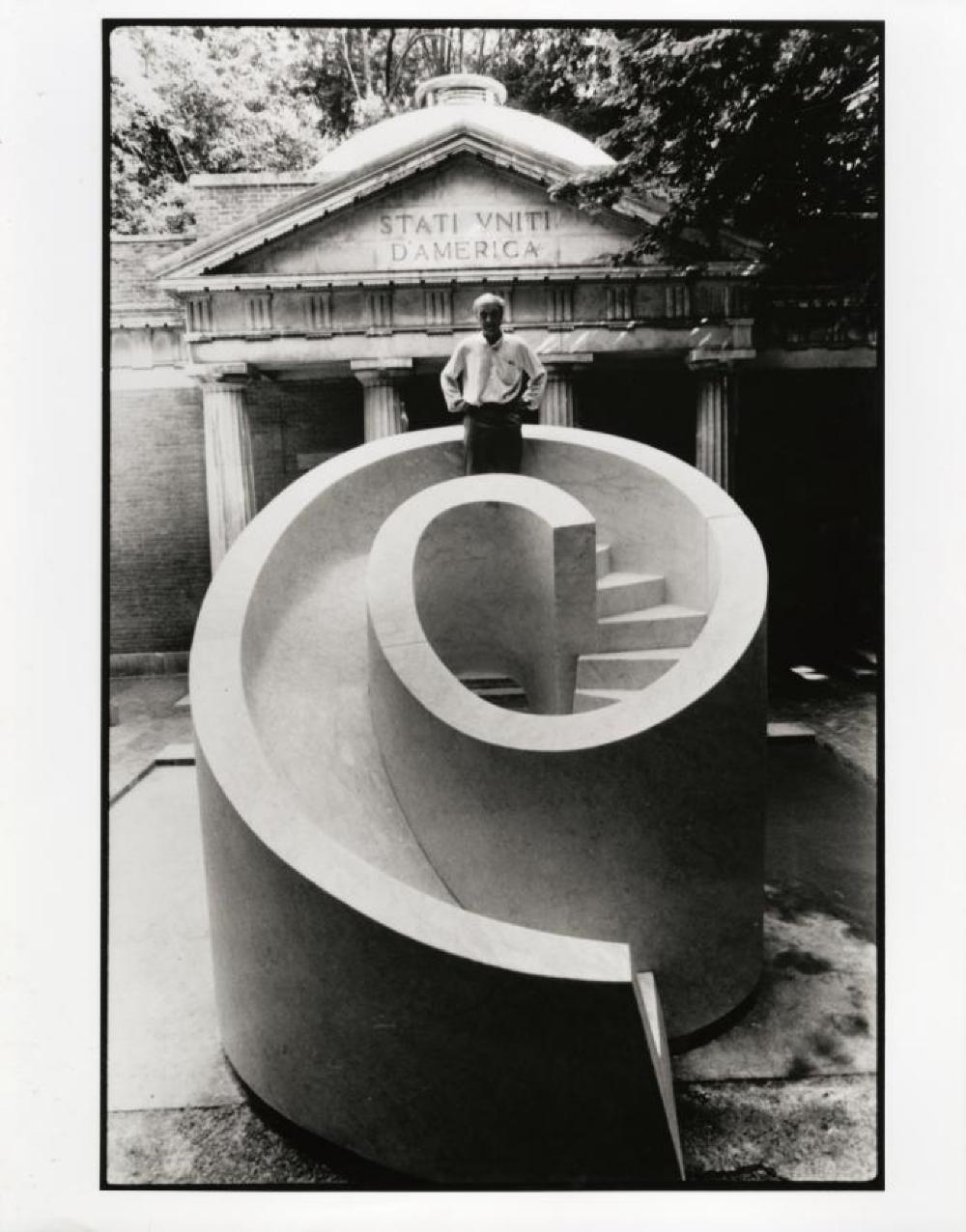 Isamu Noguchi in Venice, standing on top of Slide Mantra