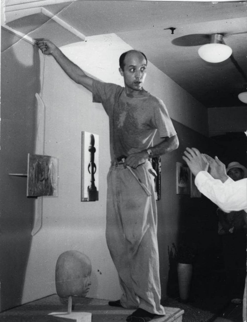 Isamu Noguchi installing "Isamu Noguchi," Mitsukoshi Department Store (Nihombashi Head Store), August 18, 1950—August 27, 1950.