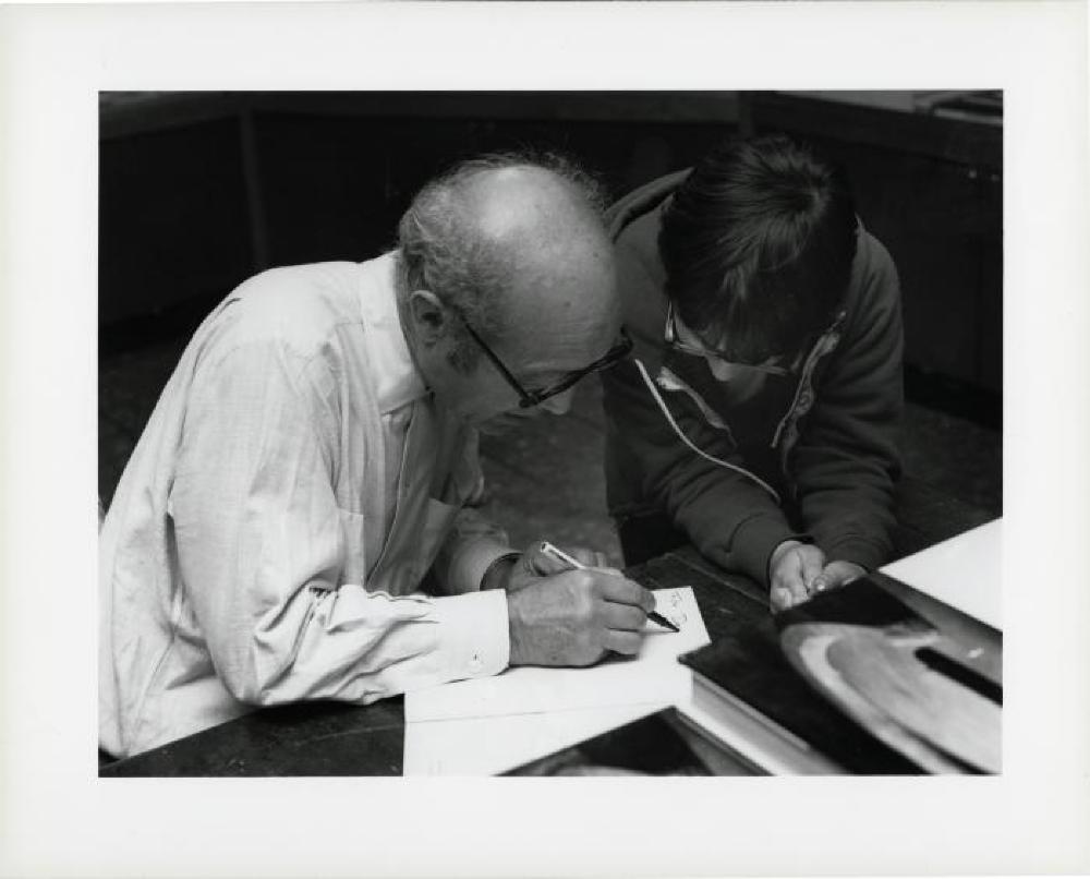 Noguchi signing catalogues at opening reception for "Noguchi's Imaginary Landscapes," Detroit Institute of Fine Arts, April 10 – June 10 1979 (travel from Walker Art Center).