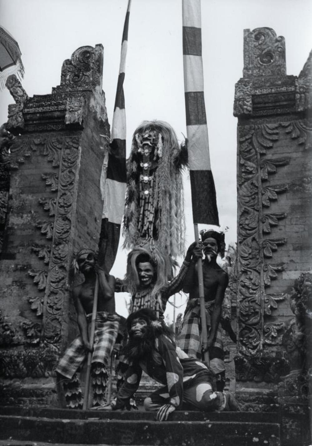 Barong performers with Candi bentar (split gate), Bali, Indonesia