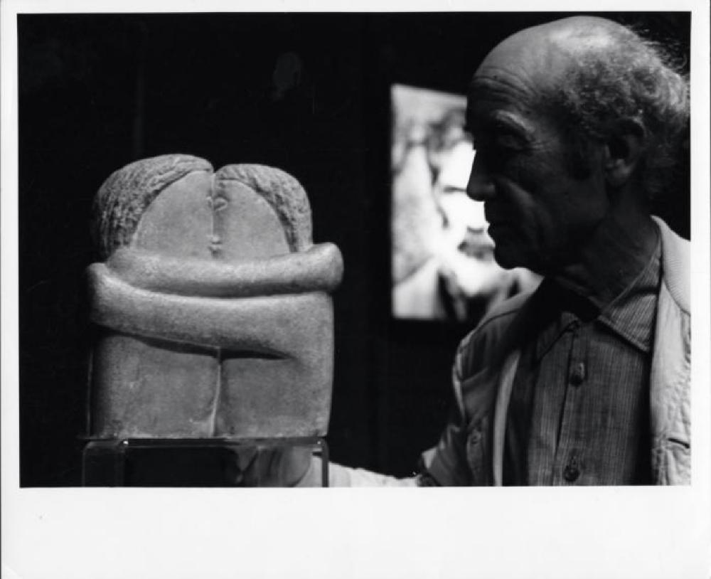 Isamu Noguchi in Romania with Brancusi sculpture, The Kiss