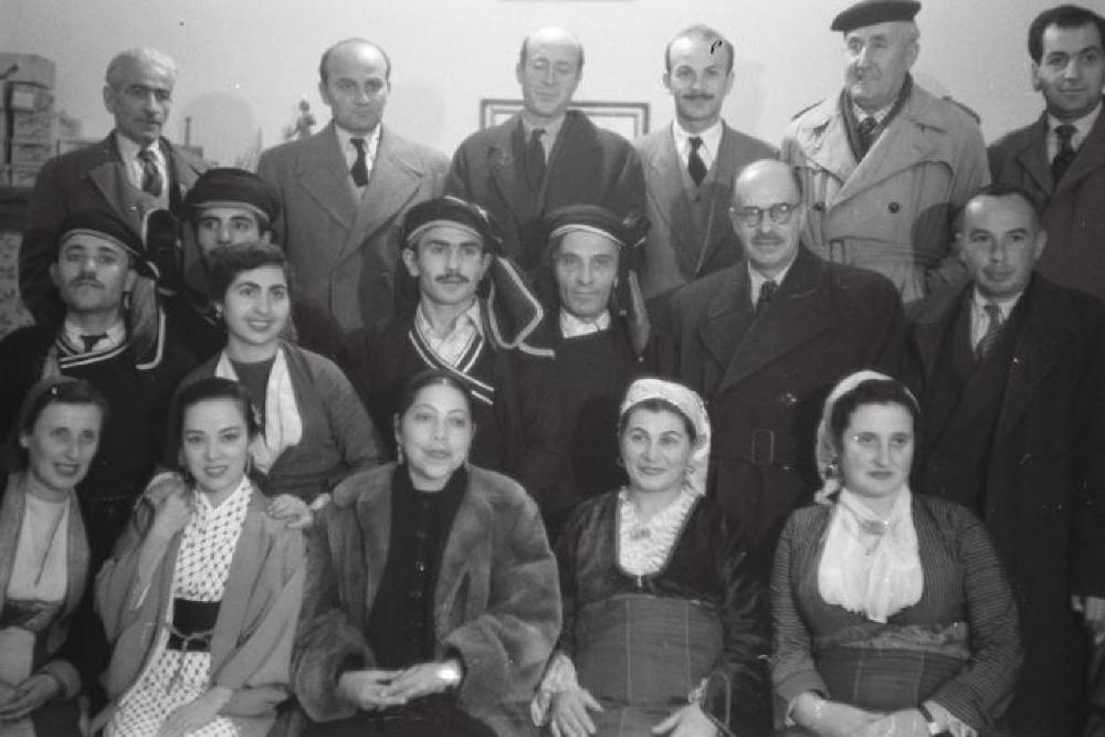 Group at performance at Dora Stratou Theatre, Athens, Greece, including: (front row, R-L) Dora Stratou, Yoshiko "Shirley" Yamaguchi, Ratna Mohini; (middle row) Nikos Hadjikyriakos-Ghika, Angelo Prokopiou; (top row) Yiannis Tsarouchis, Thanos Murray-Veloudios