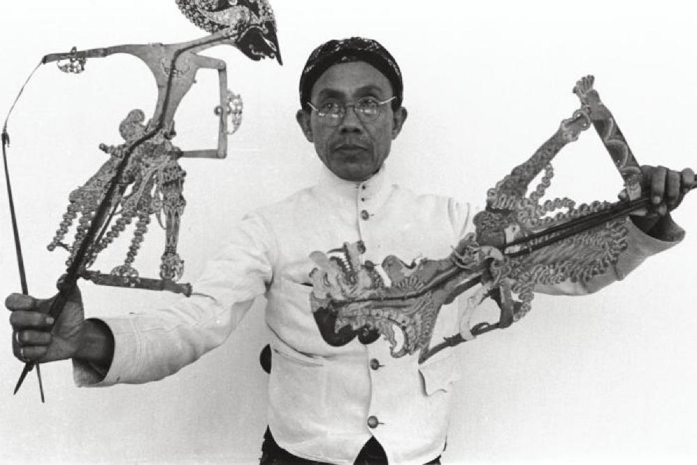 Bollingen Travels; Man with Wayang Kulit shadow puppets, Indonesia