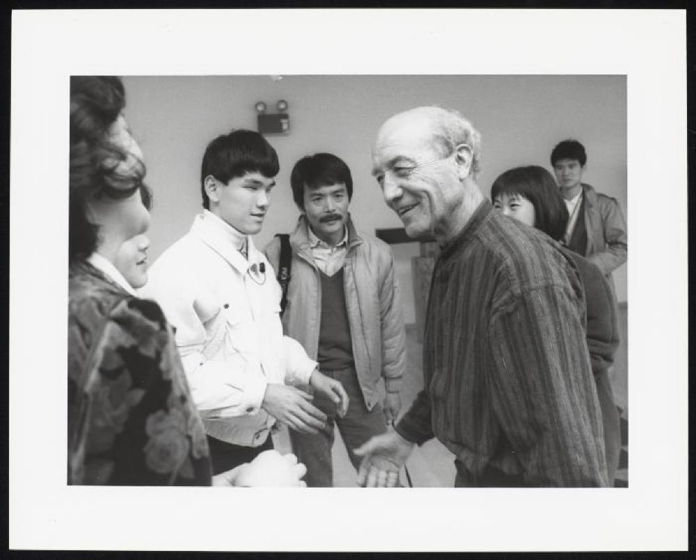 Isamu Noguchi with blind Japanese art students visiting the Isamu Noguchi Garden Museum
