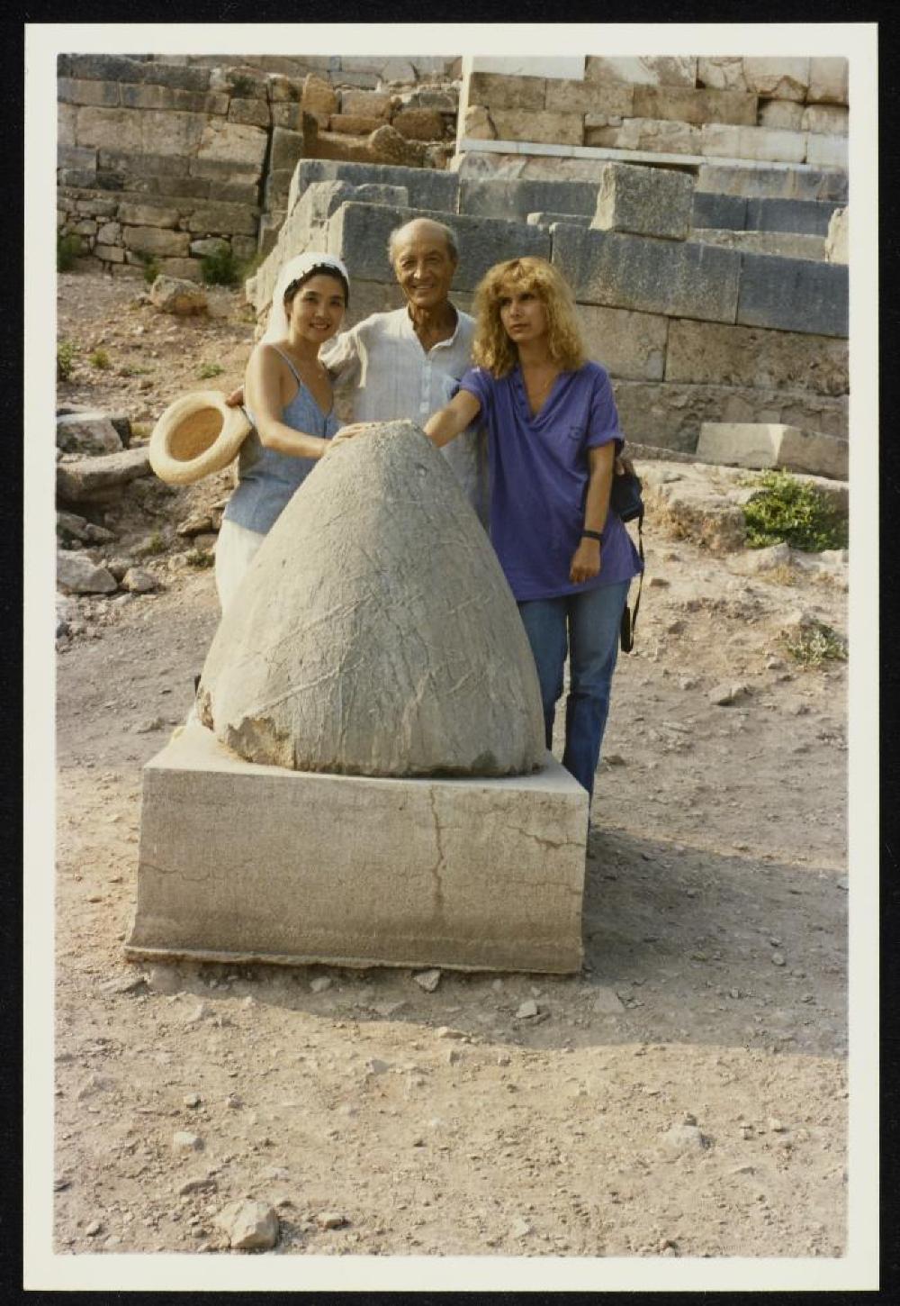 Isamu Noguchi, Kyoko Kawamura and Penny Bach with the Omphalos stone at Delphi, Greece