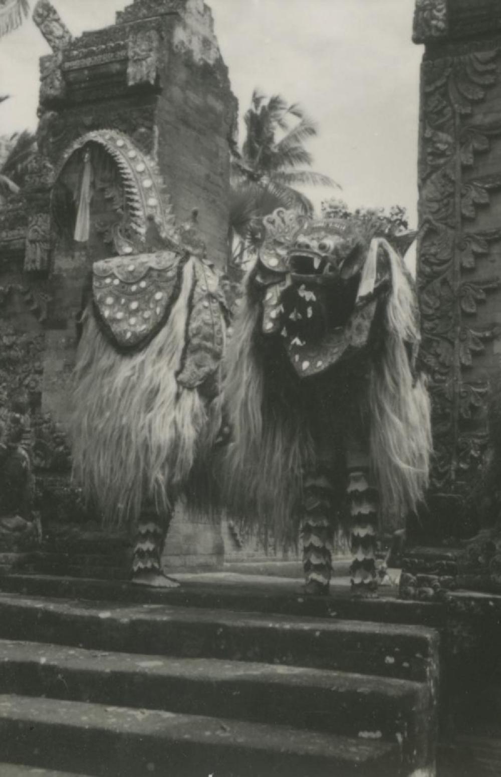 Bollingen Travels: Barong performers with Barong Ket mask at split gate in Bali, Indonesia